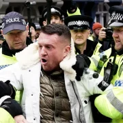 Tommy Robinson charged after attending antisemitism march in London